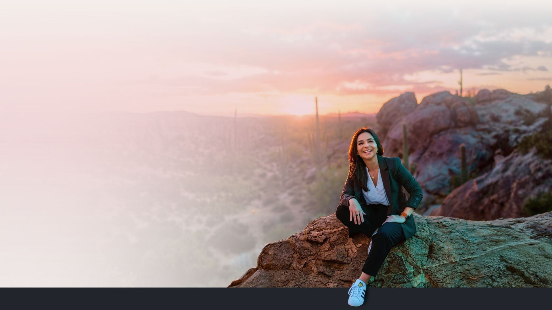 Gina Saldana, founder of Red Pen Creative, in the Arizona desert at sunset